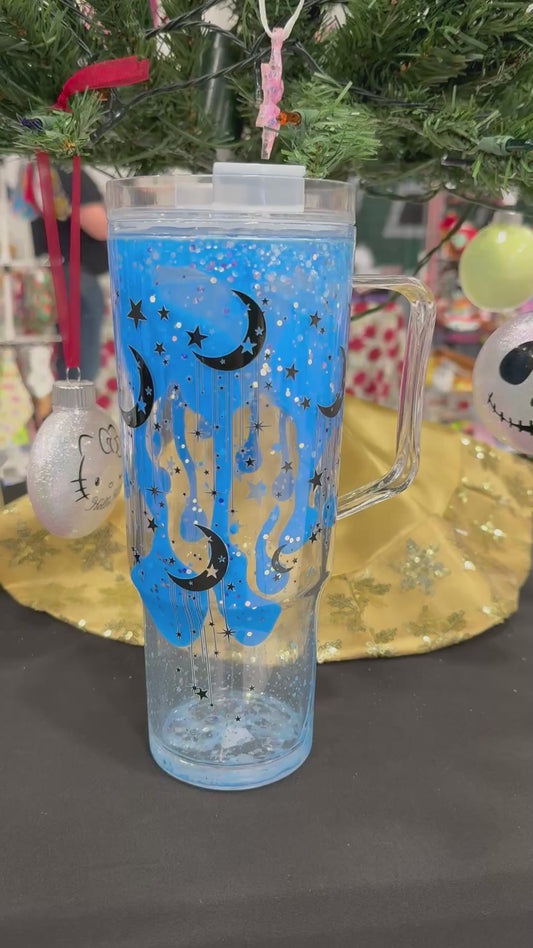 40 oz blue glow lava drip with green glow accent stars